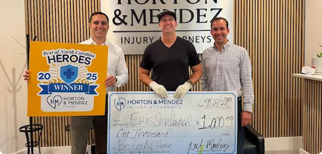 Horton & Mendez presenting Best of NC Heroes check