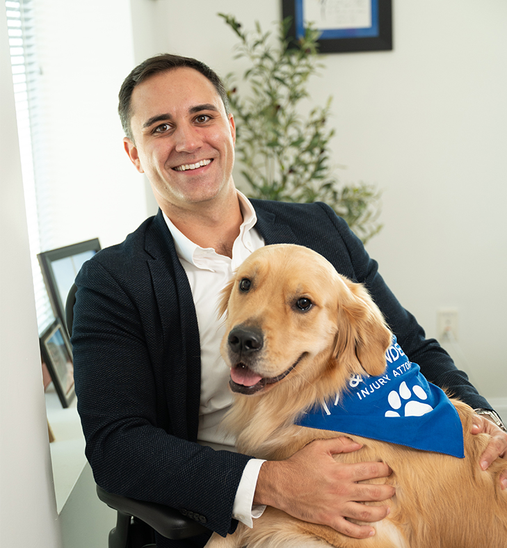Nicholas Mendez holding dog